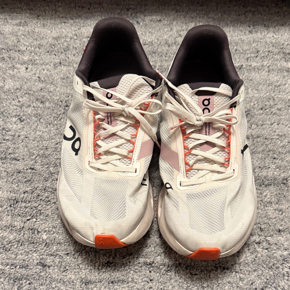 On Running Cream and Orange Athletic Shoes